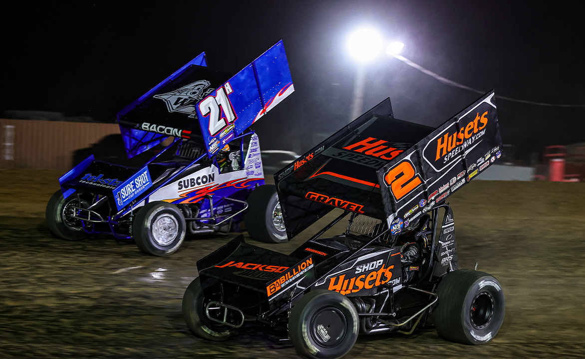 David Gravel drives by Brady Bacon at Lawton Speedway
