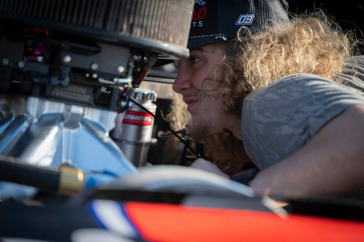 Hunter working on car