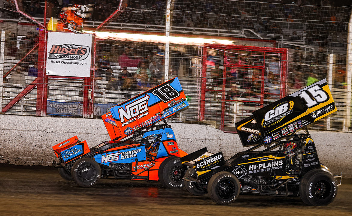 Sheldon Haudenschild racing Donny Schatz to the checkered flag at Huset's Speedway