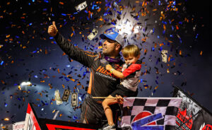 David Gravel celebrating with his son Levi at Huset's Speedway