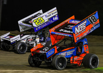 Sheldon Haudenschild racing alongside Garet Williamson at Wilmot Raceway