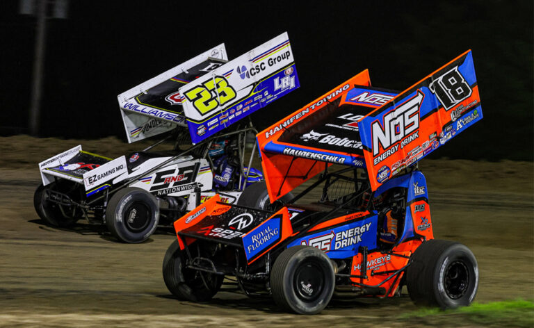 Sheldon Haudenschild racing alongside Garet Williamson at Wilmot Raceway