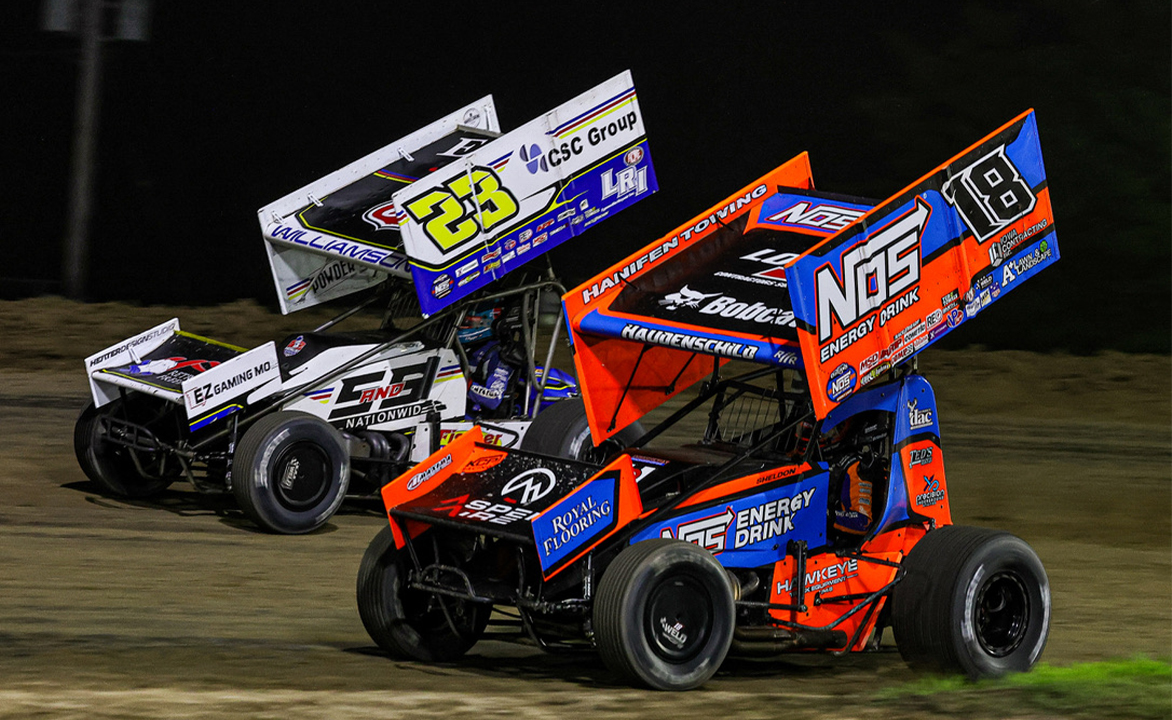 Sheldon Haudenschild racing alongside Garet Williamson at Wilmot Raceway