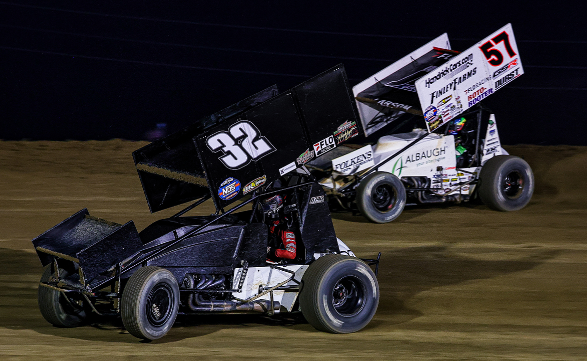 Bryce Lucius races next to Kyle Larson at Attica Raceway Park