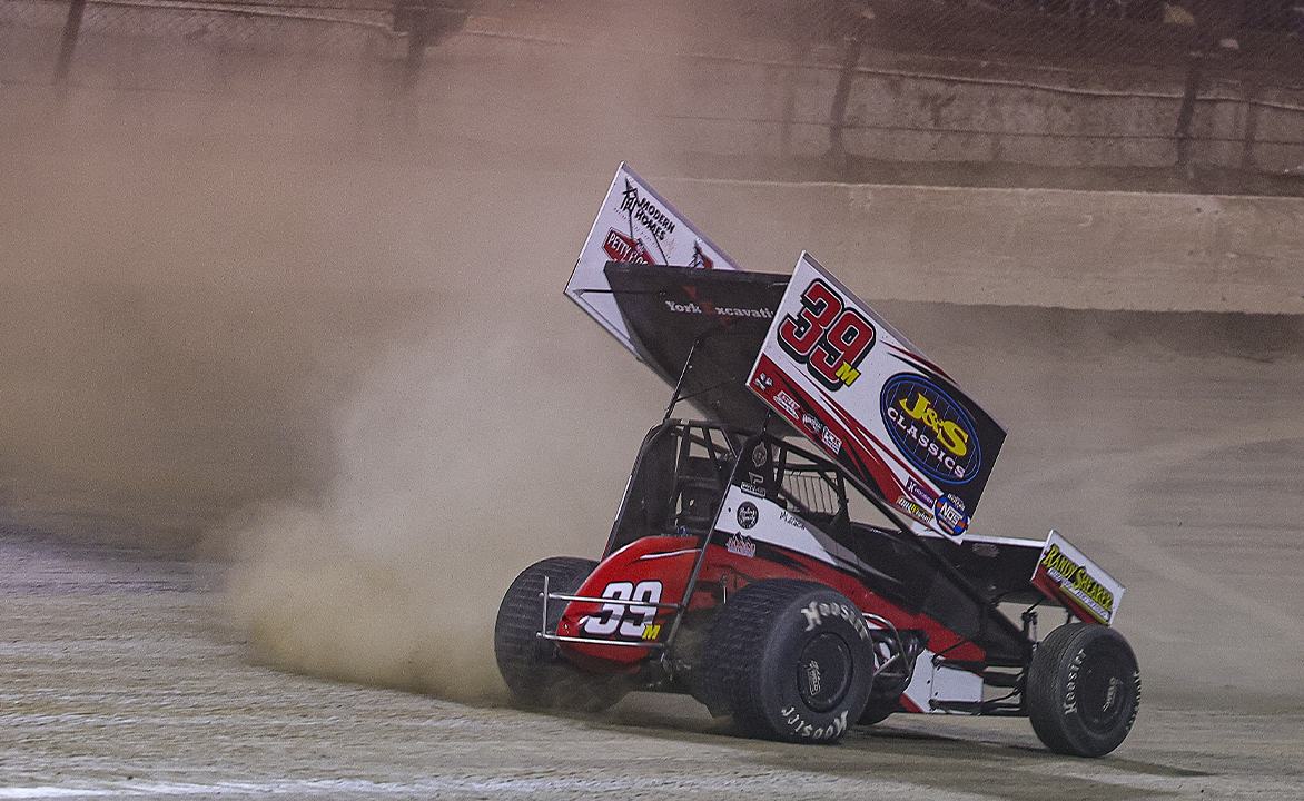 Anthony Macri celebrating by doing donuts at Eldora Speedway